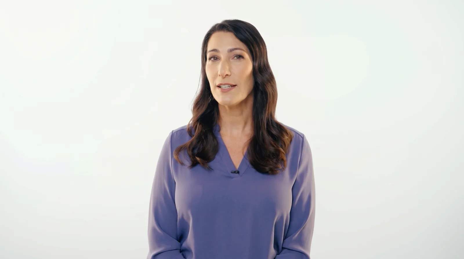 Genetic counselor Erynn Gordon speaking to camera, original frame and regraded frame